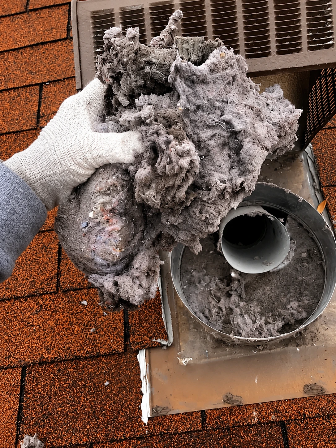 Lint blockage removed from a roof dryer vent
