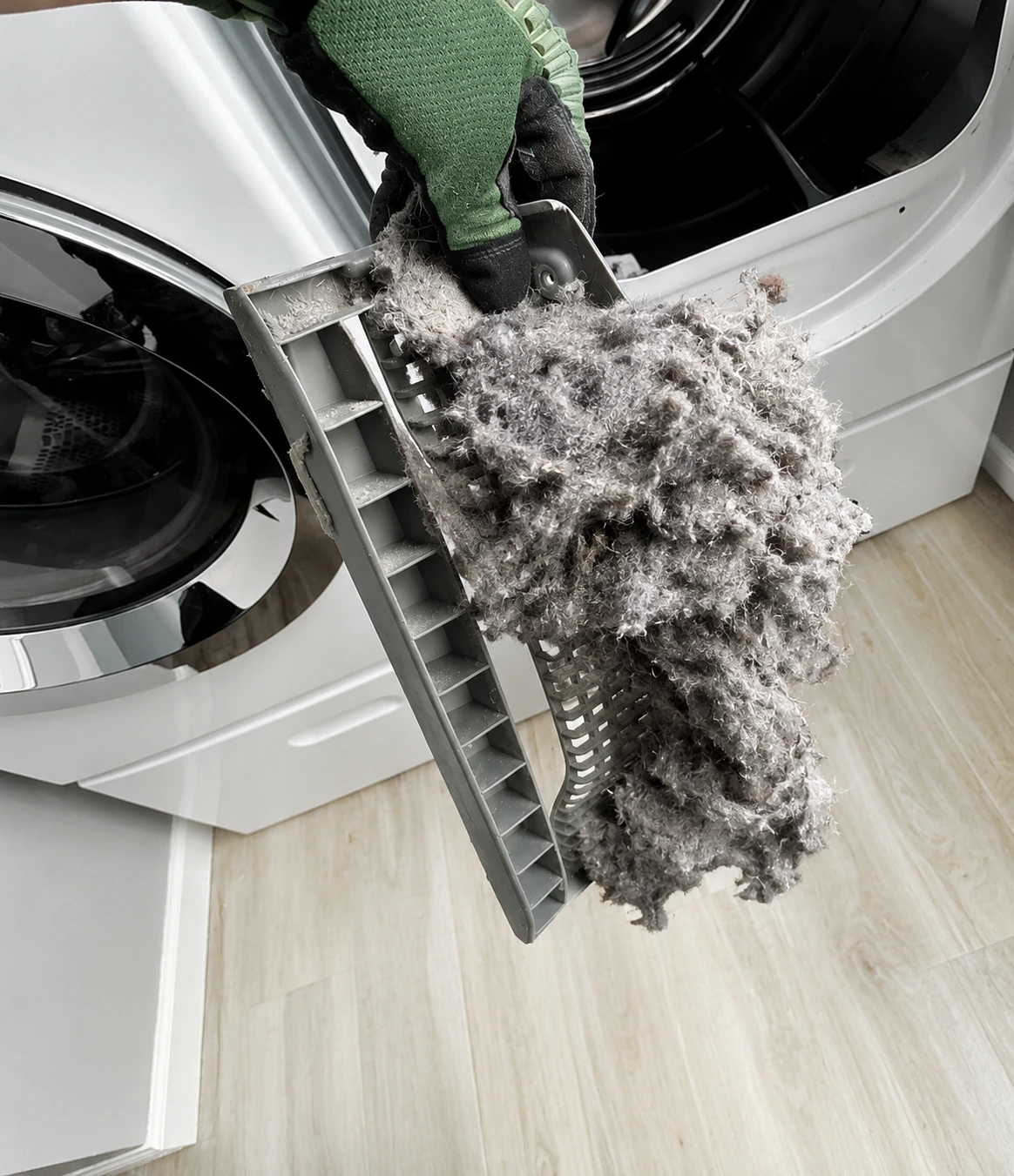 Clogged dryer lint screen removed during dryer vent cleaning service